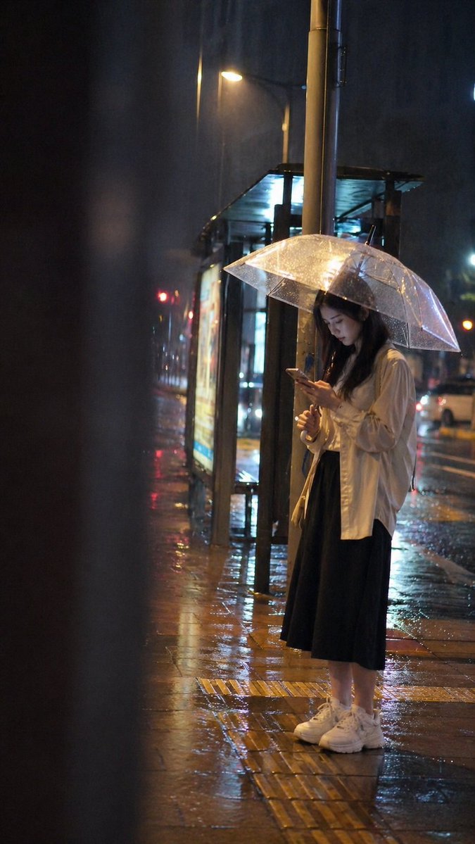 Cinematic rainy night bus stop prompt preview image 1